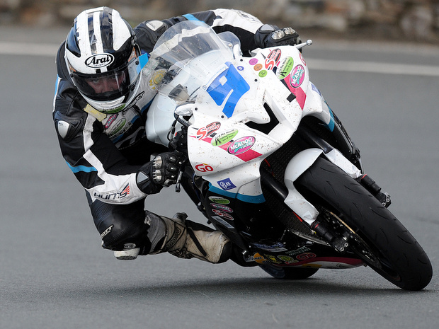 Michael Dunlop on his to victory in the Monster Energy Supersport 2 race at the 2012 Isle of Man TT